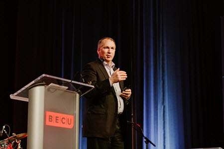 BECU CEO on stage delivering keynote speech 